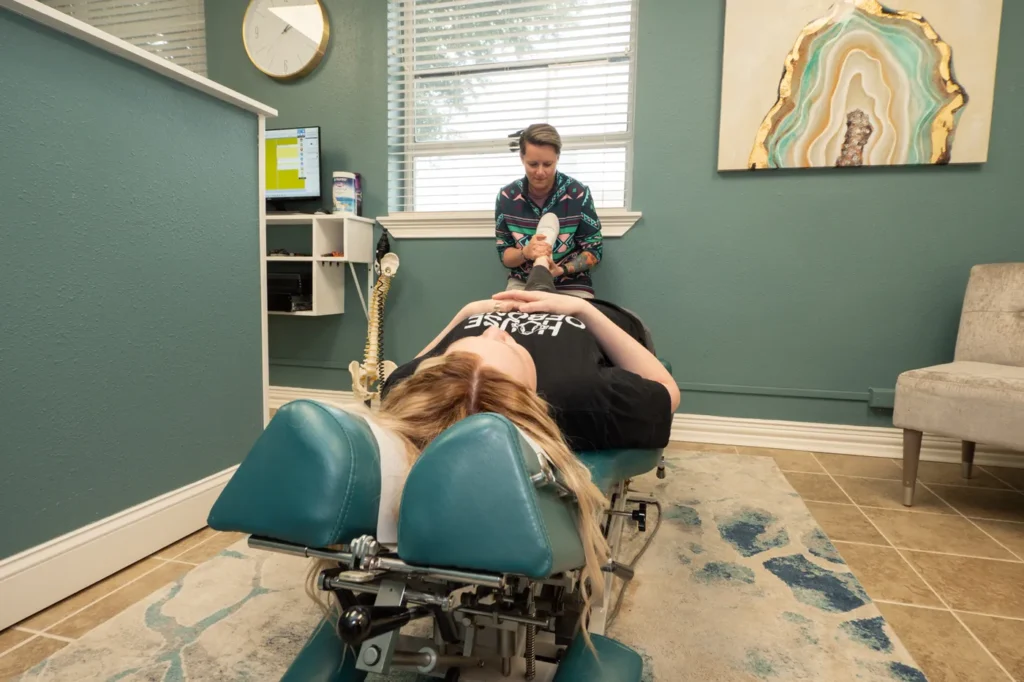 Dr Jordan Walsh working with a female patient