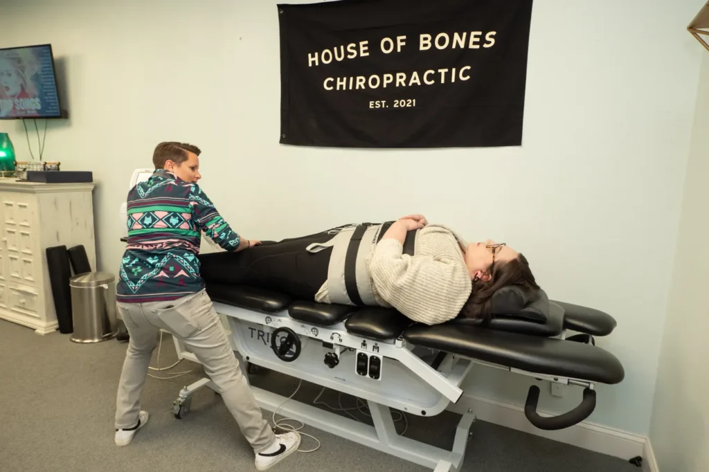 Dr Jordan Walsh working with a female patient